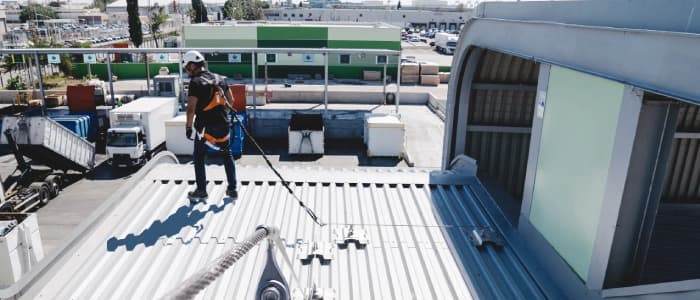 Technician inspecting lifeline safety system